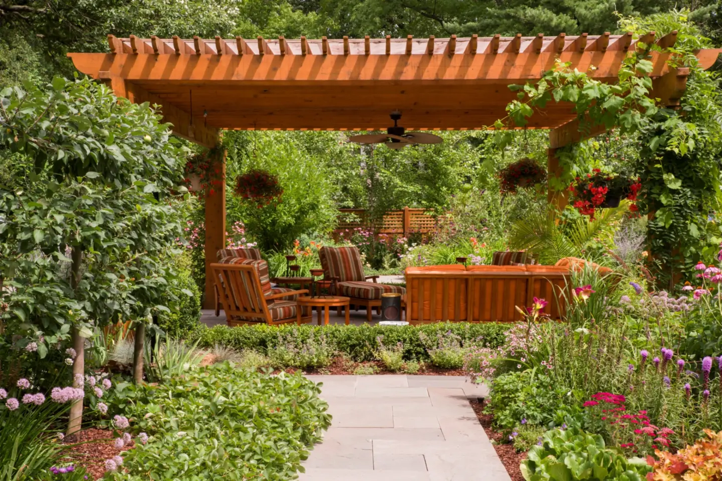 00 cedar pergola surrounded by an immaculate garden