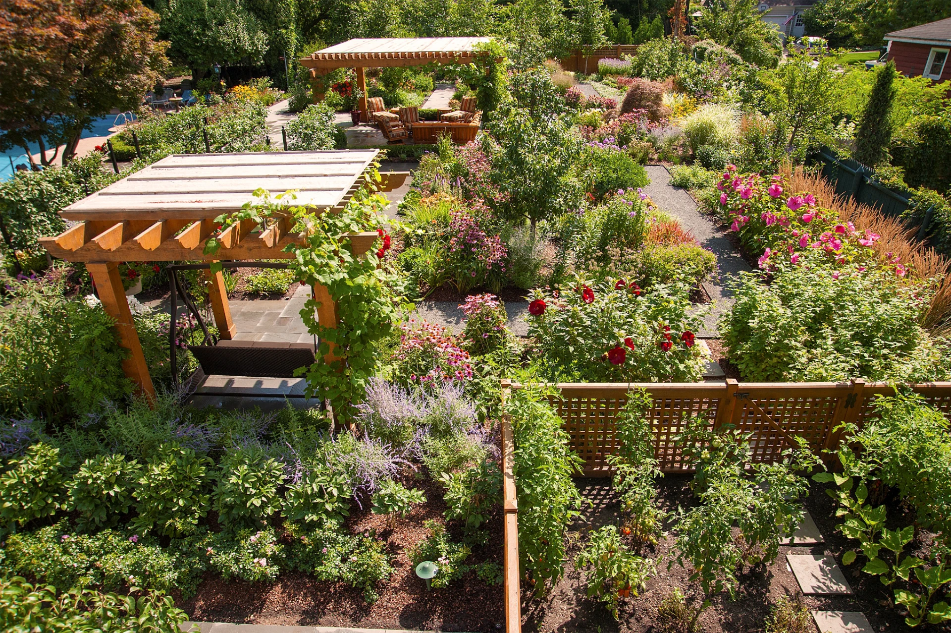 02 cedar pergolas surrounded by an immaculate garden