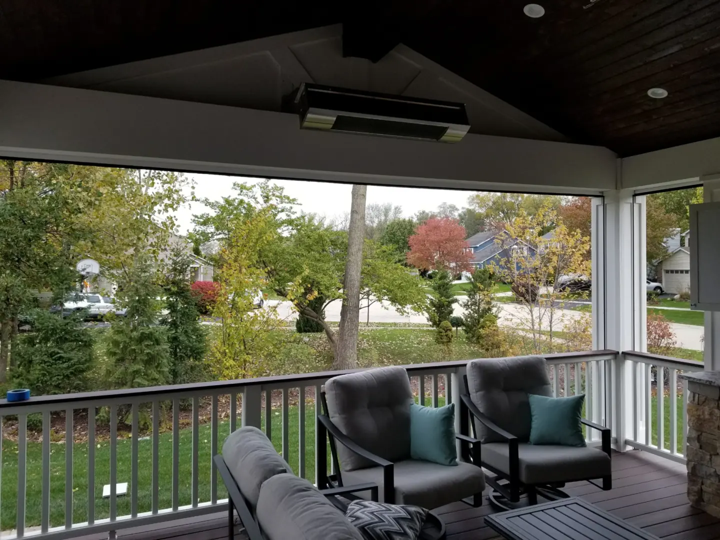 05 cushioned chairs inside of screen room with drink rail