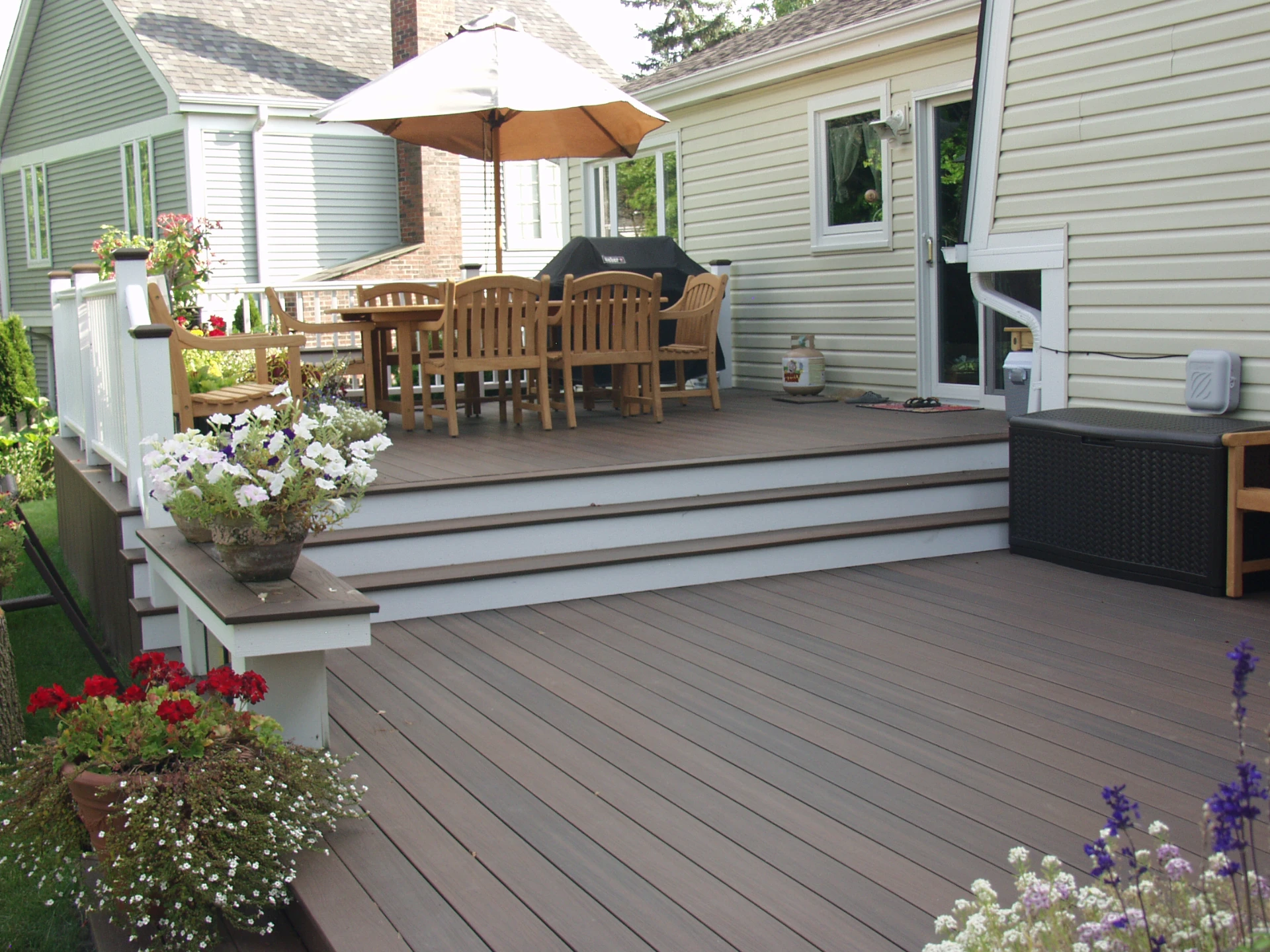 Pvc deck with outdoor furniture with white deck railing and beautiful plants in schaumburg il